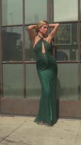  this fitted gown showcases a halter keyhole neckline and is fully adorned with shimmering sequins and beads for a dazzling effect