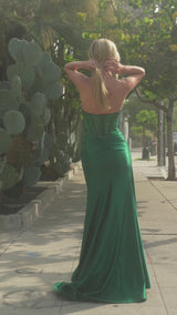 structured corset with lace-up detailing offers impeccable support, while the stretch taffeta skirt flows elegantly with a striking leg slit