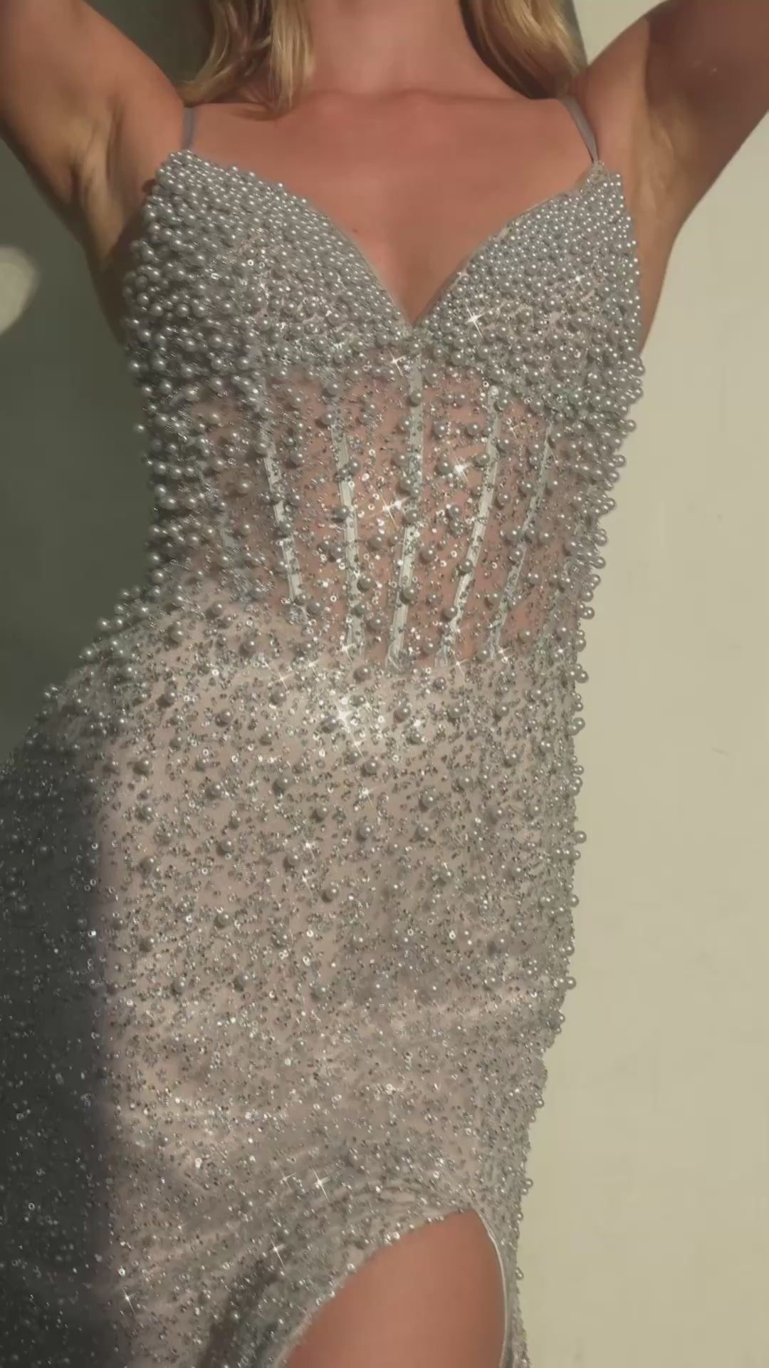 The layered glitter flocked tulle skirt flows beautifully, creating a timeless silhouette perfect for formal occasions