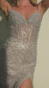 The layered glitter flocked tulle skirt flows beautifully, creating a timeless silhouette perfect for formal occasions