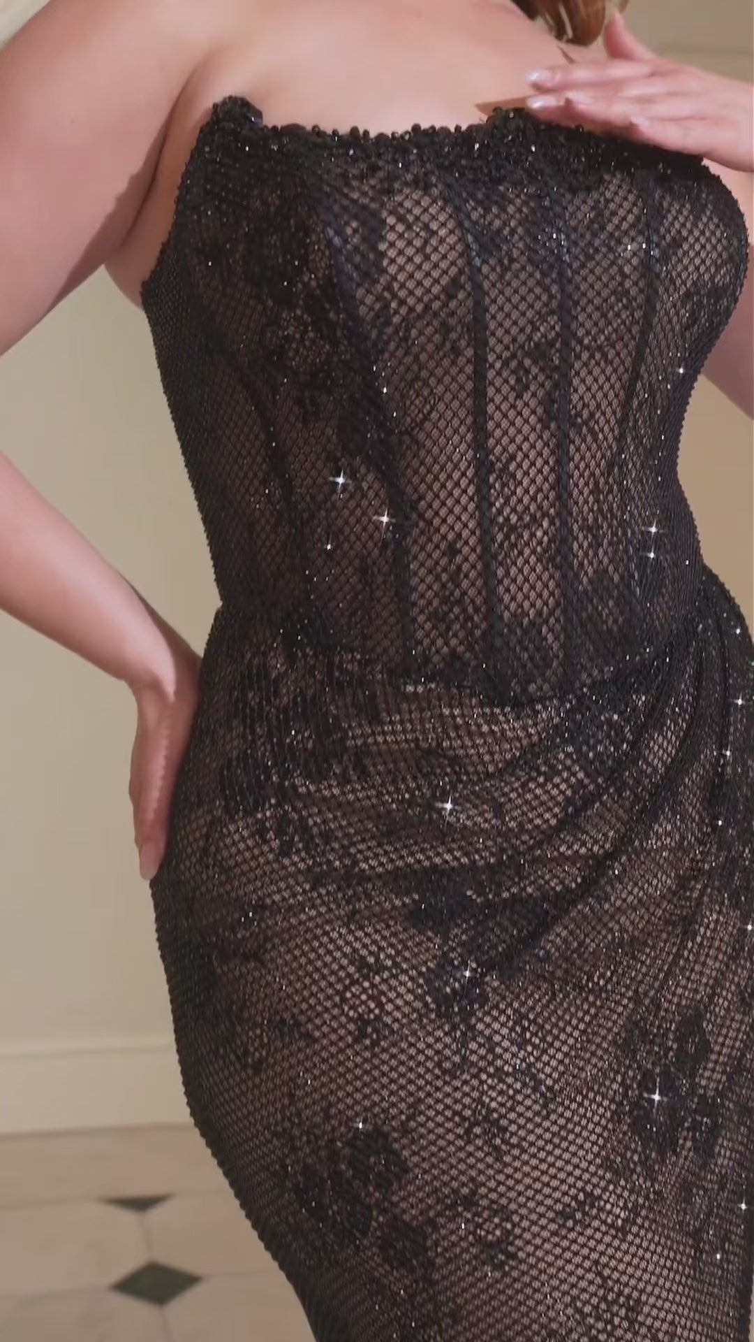 fully beaded gown features a sleek, fitted silhouette