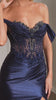  fitted gown pairs a sculpted corset bodice with luxe off-the-shoulder draping 