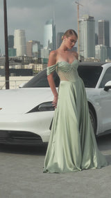 A-line gown combines a strapless sweetheart neckline with removable off-the-shoulder straps 