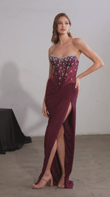 fitted gown featuring a strapless sheer corset bodice and shimmering beaded embellishments