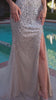 fitted evening gown, designed with delicate spaghetti straps and a sweetheart neckline that highlights the beaded bodice adorned with crystals