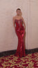 fitted gown showcases a daring deep illusion neckline and intricate crystal beading