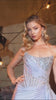 fitted gown captivates with its asymmetrical strapless neckline and hand-beaded embellishments