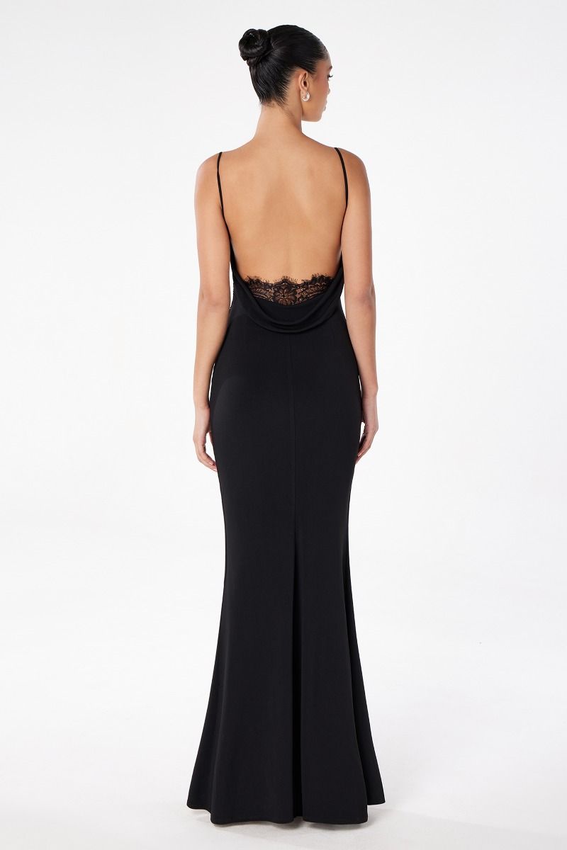 Black evening gown with open back on a white background
