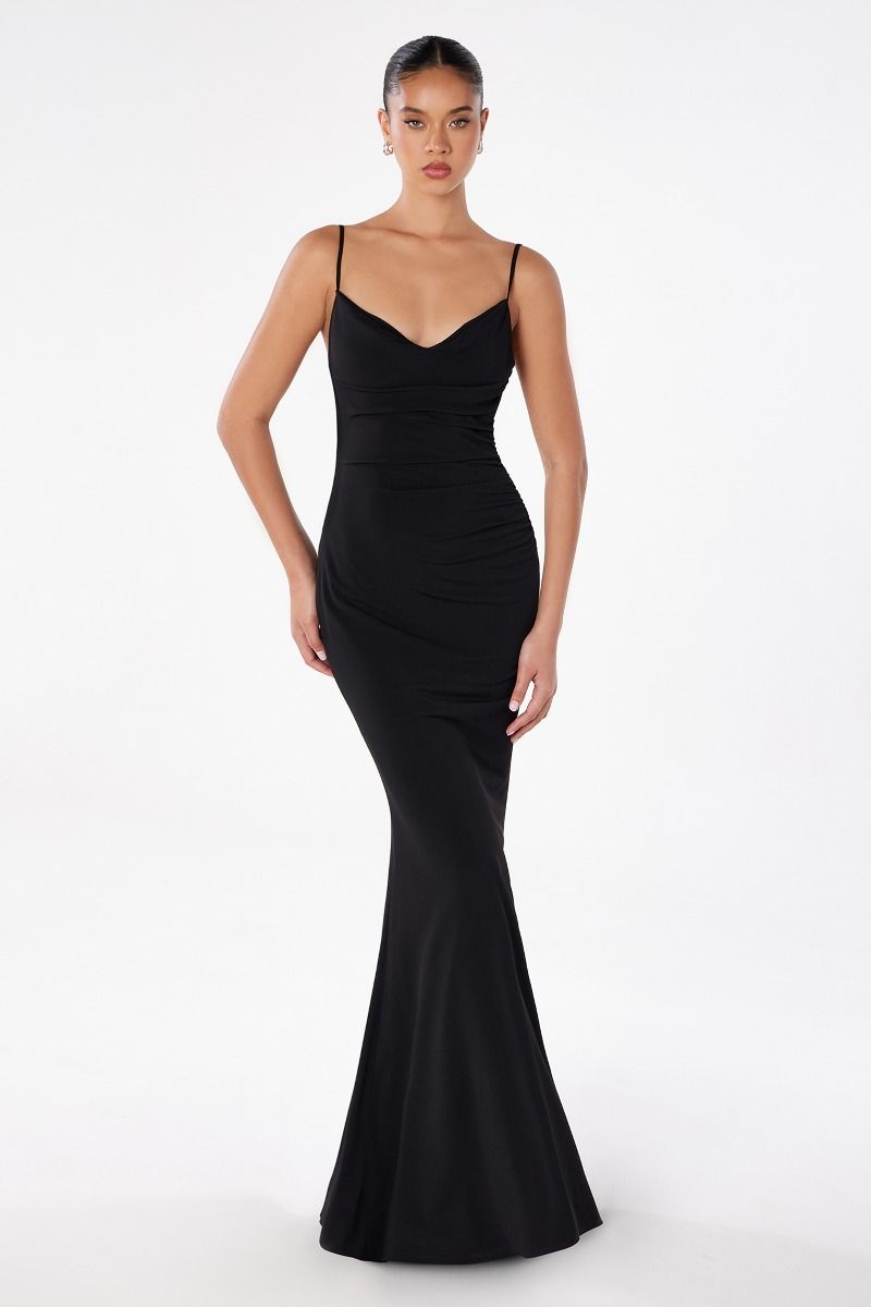 Woman wearing a black evening gown on a white background