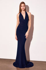 Navy blue evening gown on a model against a white background