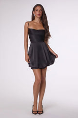 Woman wearing a black dress on a white background