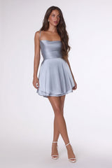 Woman wearing a silver dress on a white background