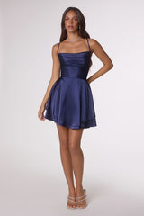 Woman wearing a blue dress on a white background