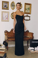 chiffon gown, designed with a sleek strapless neckline and soft, body-sculpting draping