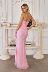 chiffon gown, designed with a sleek strapless neckline and soft, body-sculpting draping