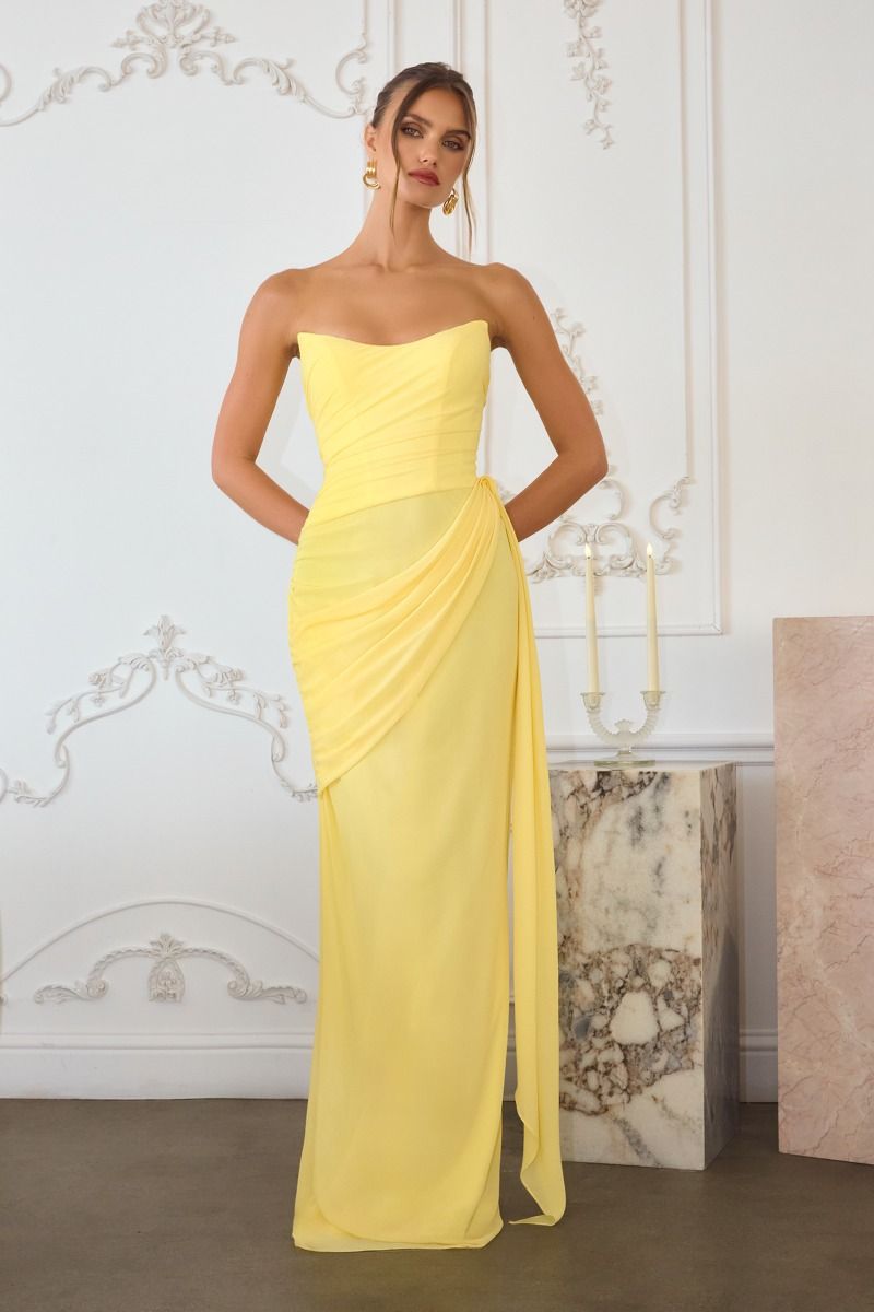 chiffon gown, designed with a sleek strapless neckline and soft, body-sculpting draping