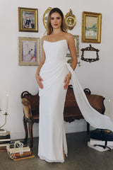 chiffon gown, designed with a sleek strapless neckline and soft, body-sculpting draping