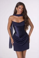 Navy blue dress worn by a model on a white background