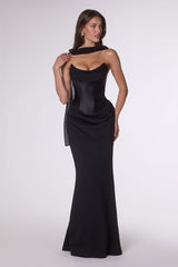 Woman wearing a black evening gown on a white background