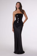 Black strapless evening gown with sequin details on a white background