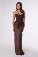 Woman wearing a brown strapless gown on a white background