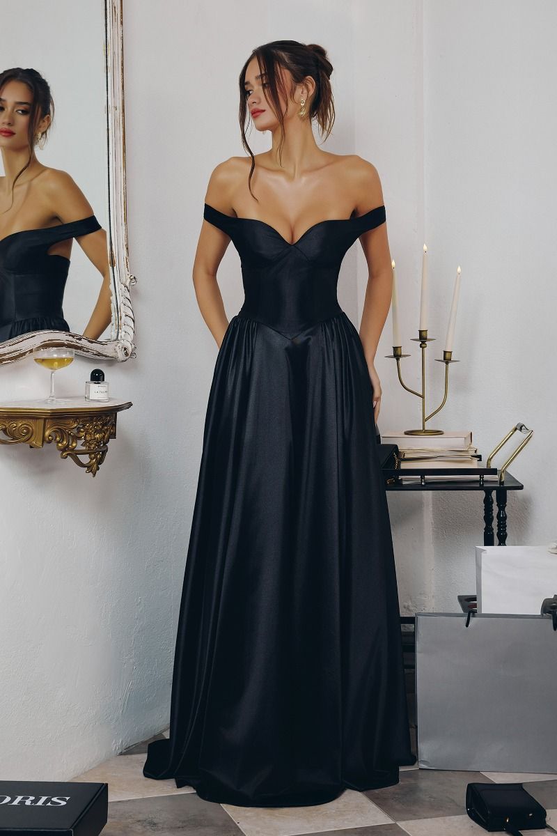 off-the-shoulder satin gown features a structured bodice and a flowing skirt