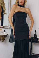 strapless gown features a structured satin bodice paired with a flowing chiffon skirt