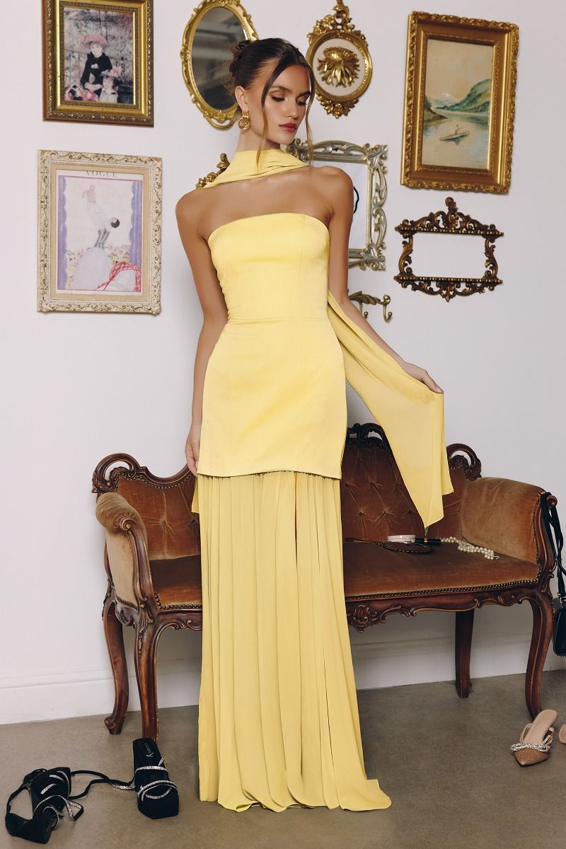 strapless gown features a structured satin bodice paired with a flowing chiffon skirt