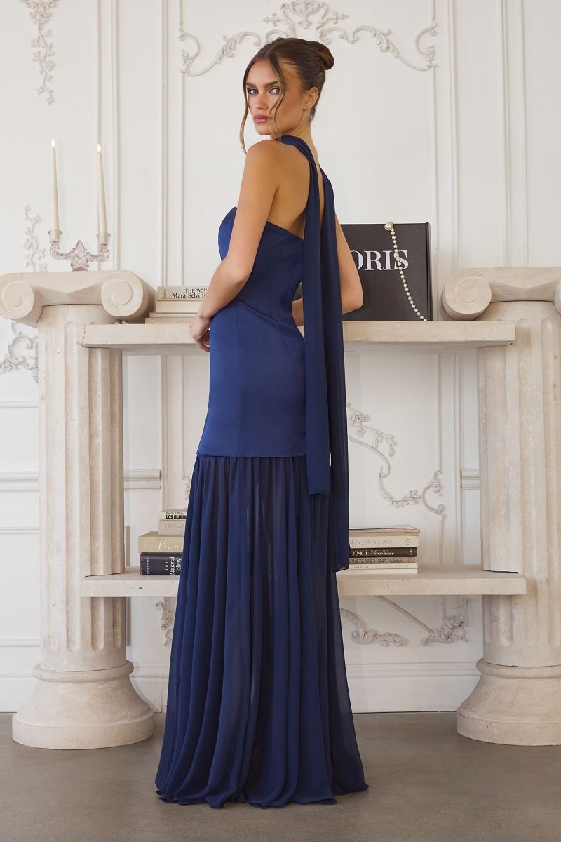 strapless gown features a structured satin bodice paired with a flowing chiffon skirt