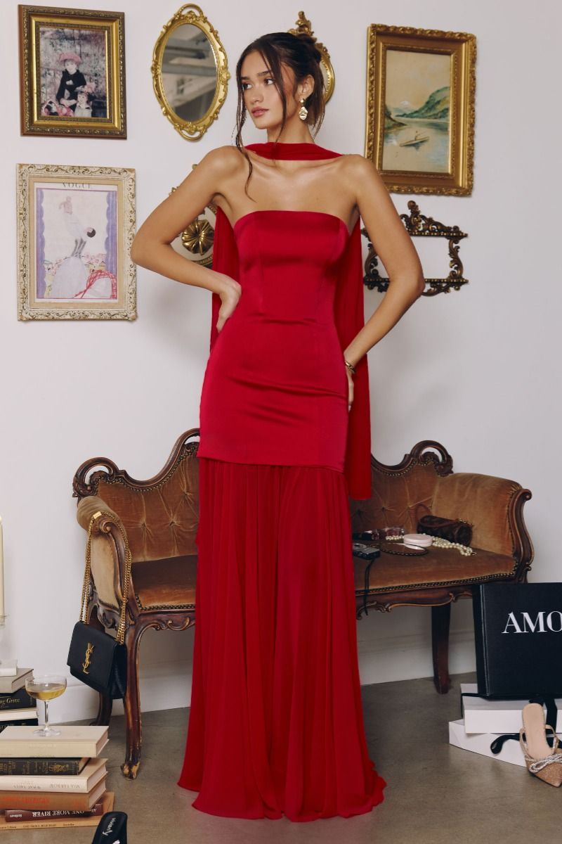 strapless gown features a structured satin bodice paired with a flowing chiffon skirt