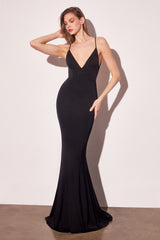 Woman wearing a black evening gown against a white background