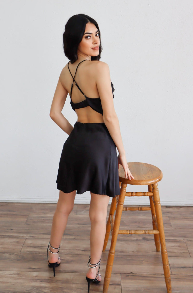 Black mini slip dress with open back and adjustable criss cross straps 