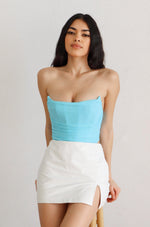 aqua strapless corset with white leather mini skort