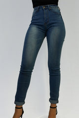 High waisted blue denim skinny jeans.