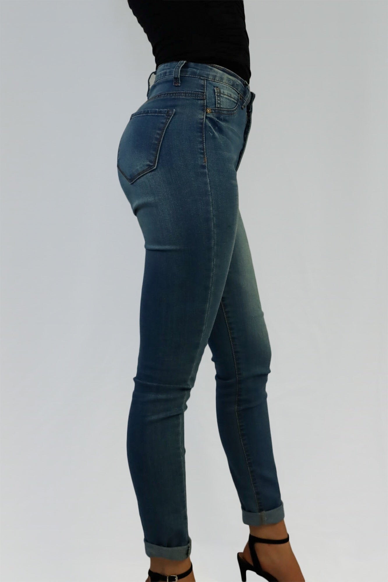 High waisted blue denim skinny jeans.