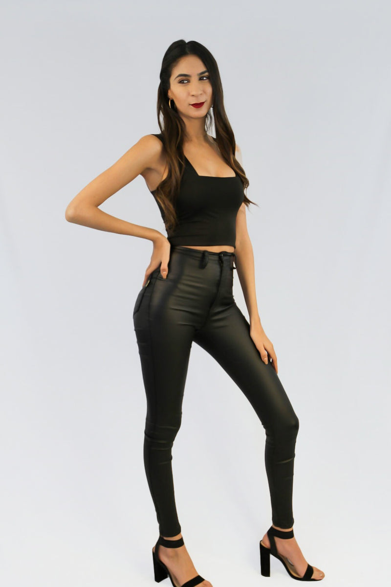 Tight cropped tank top in black.