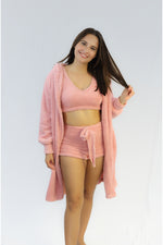 Three piece lounge set with a cardigan, bra top, and shorts.