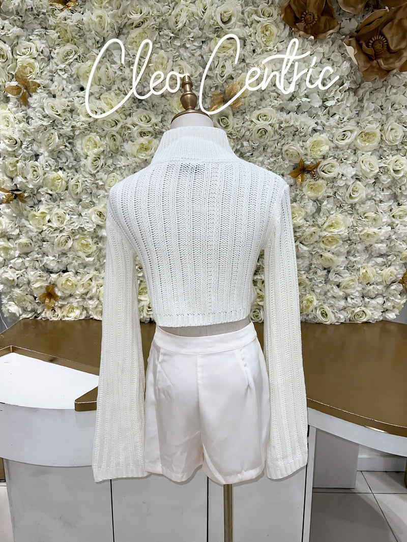 White cropped sweater with belle sleeves.