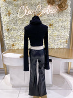 Low waisted leather pants with side ties.