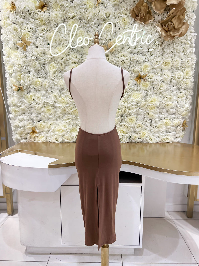 Backless midi dress with back slit, rhinestone strap detail, and adjustable straps in brown.