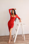 Black ruched midi dress with mesh long sleeves, halter tie and slit. 