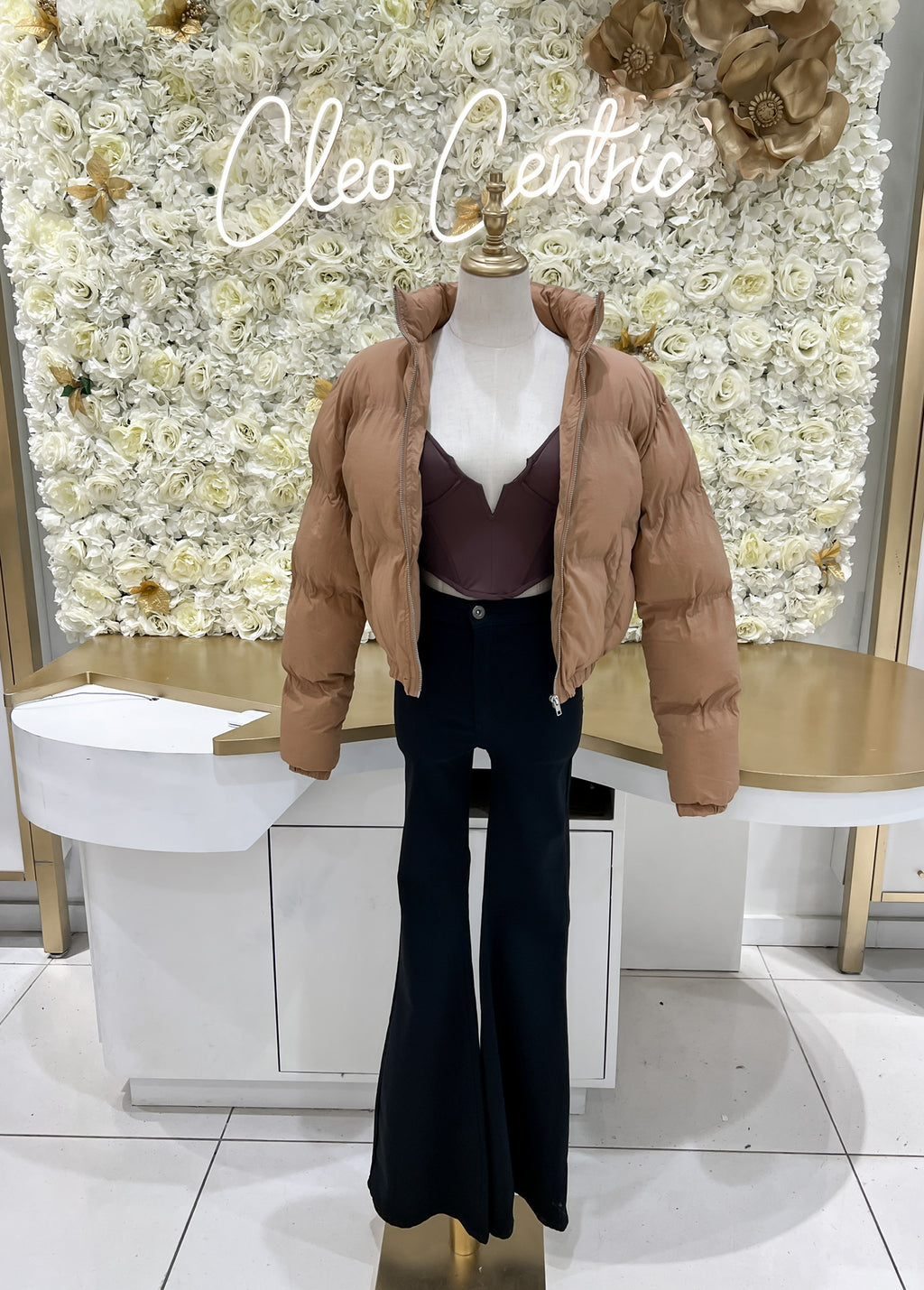 Brown puffer jacket.