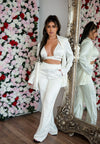 Satin blazer paired with satin bra top and satin pants in white.