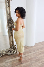 Gold strapless midi dress with rhinestones and pearls. 