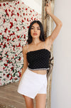 Black crop top with rhinestone straps.