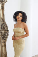 Gold strapless midi dress with rhinestones and pearls. 