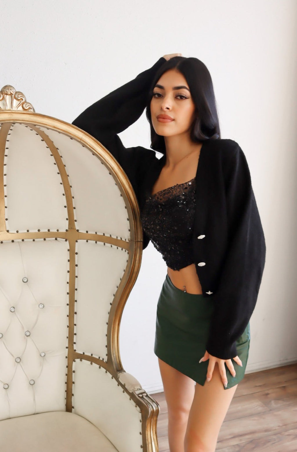 Cardigan in black with jewel buttons.