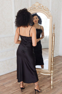Black feather lined top midi slip dress with adjustable straps.