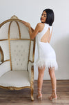 Sequin asymmetrical mini dress with feather hemline and open back in White.