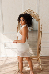 Champagne sequin halter mini dress.